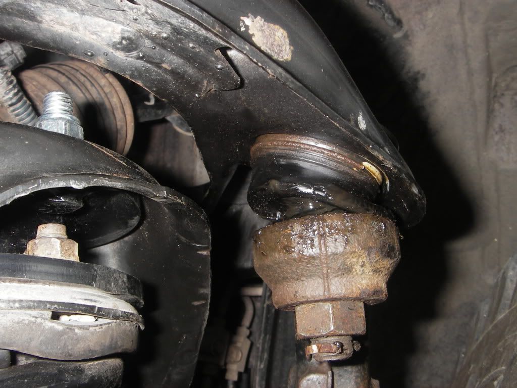 Spindle and Upper control arm, boot cover. Second Generation Nissan