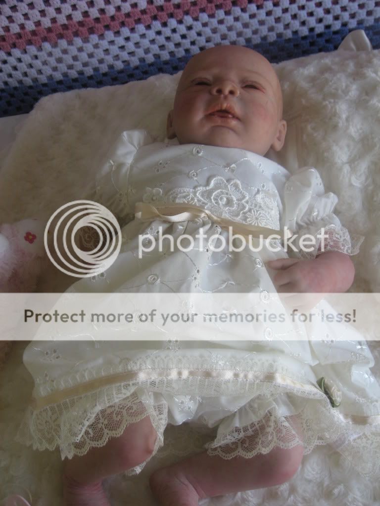  clothes she is wearing in the photos, Disposable nappy, White socks 